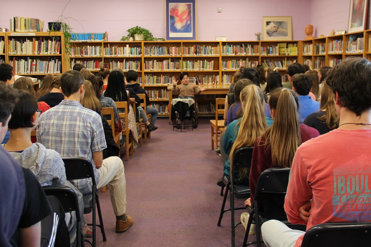 People Listening To A Speaker